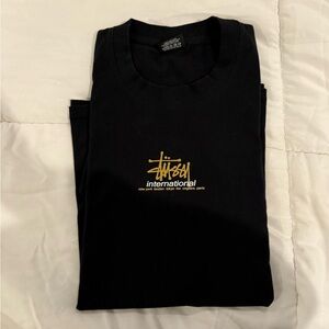 New Stussy Intl Men’s Tee 
Size Medium
Black shirt with logo on front